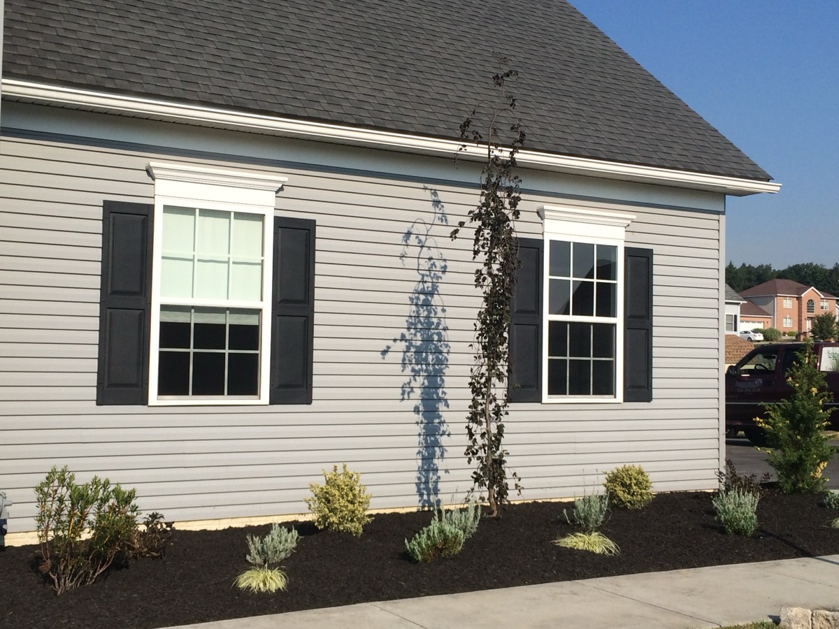 Fresh mulch installation around a home