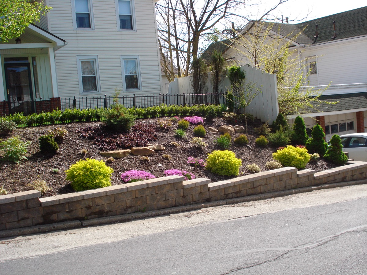 Retaining wall paired with landscape plantings