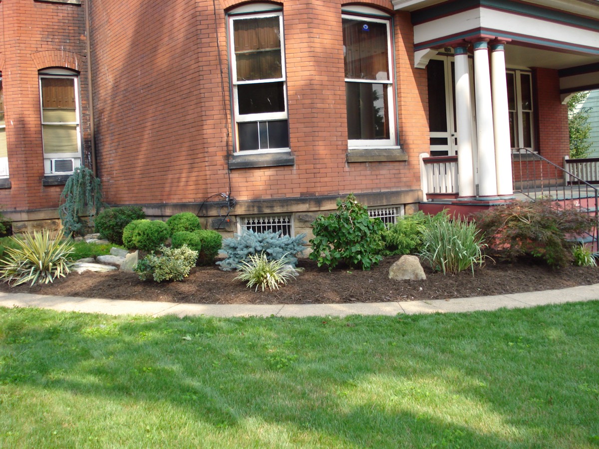 New plantings and mulch beds around a home