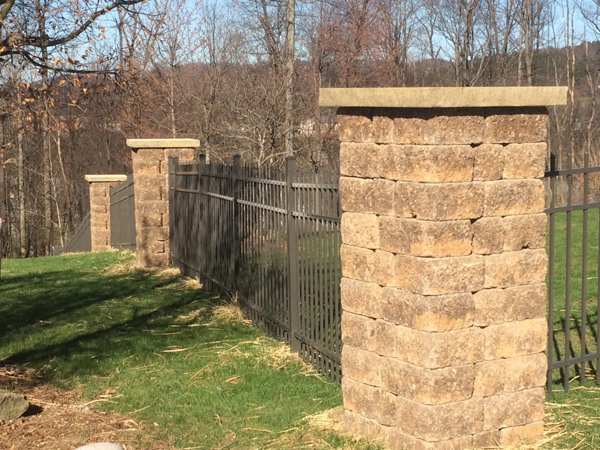 Fence with stone pillars
