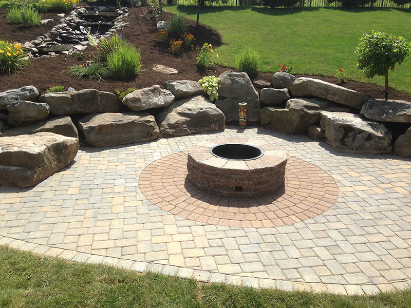 Paver patio with built-in outdoor fireplace